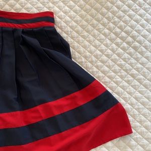 Pleated A-line skirt. Tommy Hilffiger size 10. Dark Navy/Rich red.